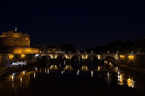 Rome, Italy - May 31, 2018: Sant' Angelo Bridge, Sant' Angelo Castel (Castle of the Holy Angel, Mausoleum of Hadrian) and Tiber river at night.