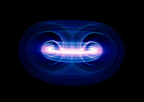 High Energy Particles Flow Through A Tokamak Or Doughnut-Shaped Device. Antigravity, Magnetic Field, Nuclear Fusion, Gravitational Waves And Spacetime Concept