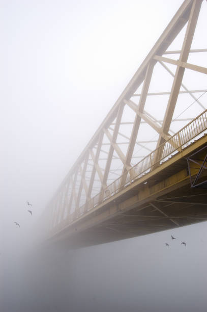istock Bridge vanishes into winter fog 1092184790