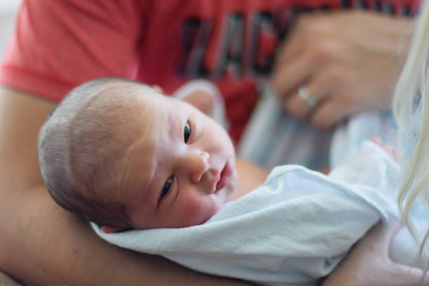 istock New dad holding baby girl 1092185246