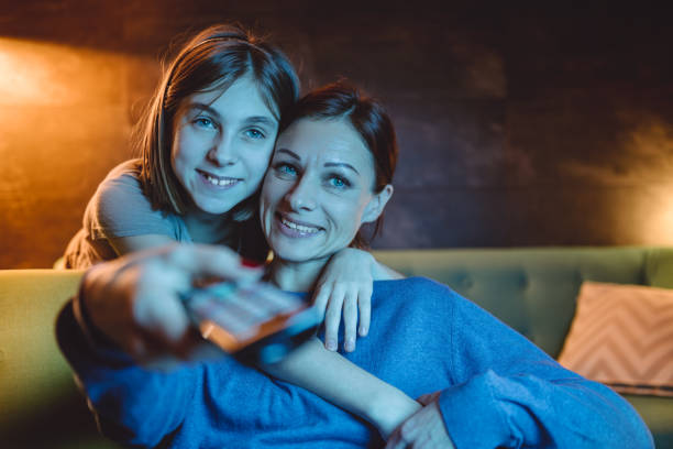 istock Mother and daughter watching TV 1092186722