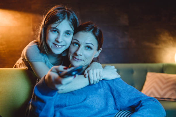 istock Mother and daughter watching TV 1092186952
