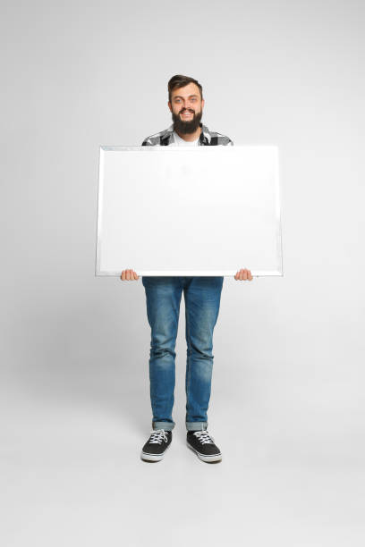 istock Positive man with mockup poster 1092187760