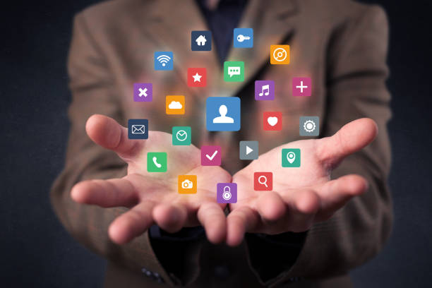 istock Businessman holding colorful applications 1092192300