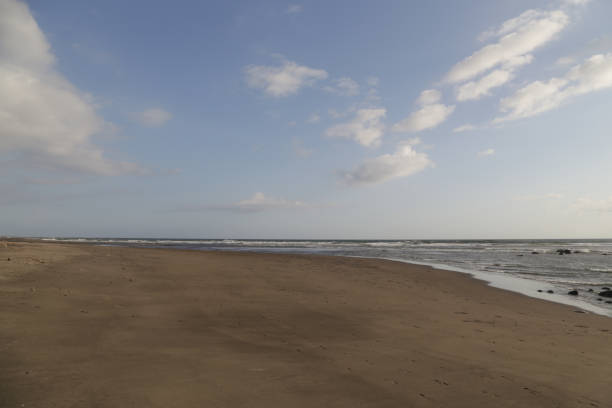 istock Empty sand beach with a clear blue sky, no people 1092197588