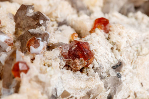 istock Macro mineral stone Spessartine, Feldspar, Smoky quartz, on a white background 1092203764