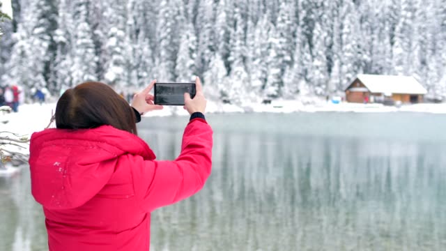 Traveler take a Photo of Lake Louise