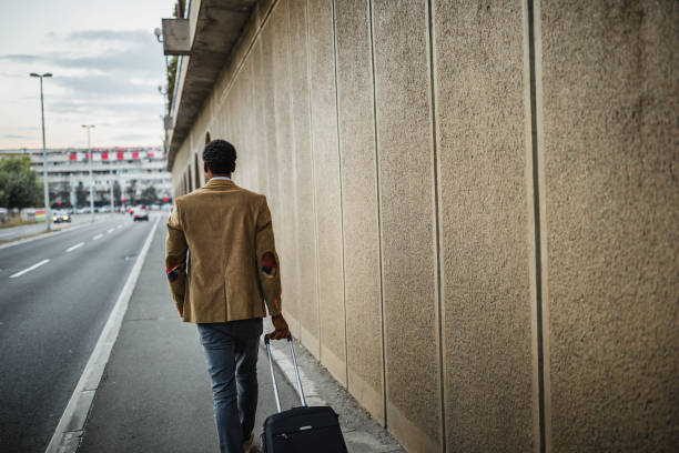 istock African man pulling suitcase and going on business meeting 1092210544