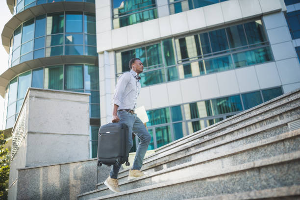 istock African man pulling suitcase and going on business meeting 1092210774