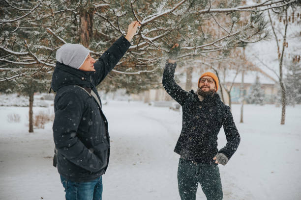 istock Two others walk through the park and have fun in the snow 1092212214