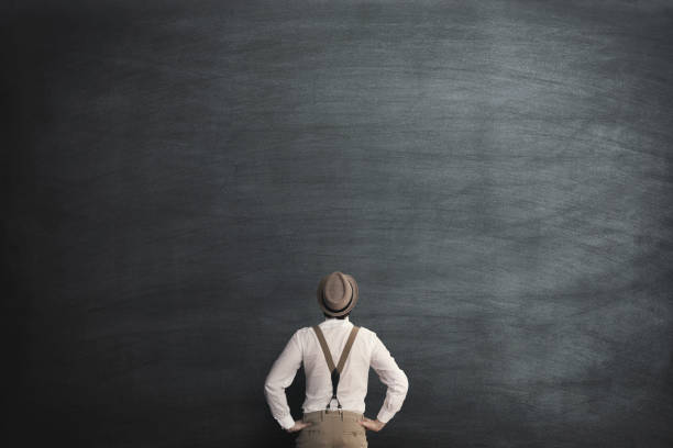 istock man in front of chalkboard thinking 1092212560