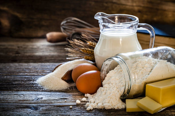 istock Dough preparation ingredients on rustic wooden table 1092236128