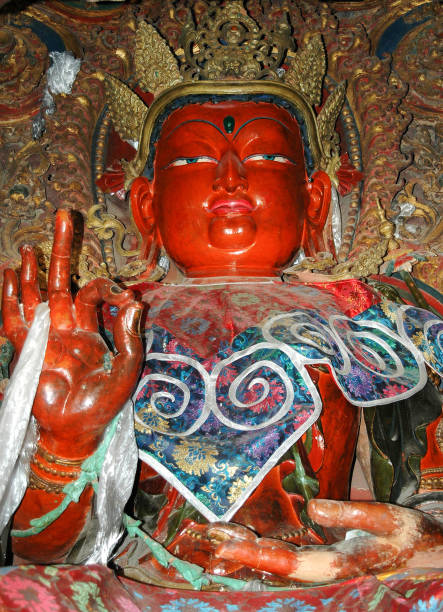 istock Big buddha statue with a red face in a monastery in Tibet 1092236150