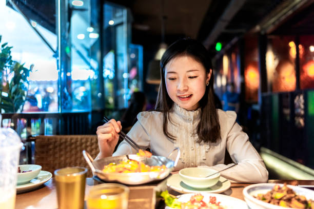 istock Asian young women is eating dinner 1092242630