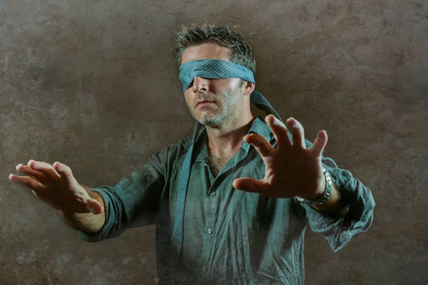 istock young lost and confused man blindfolded with necktie playing internet trend dangerous viral challenge with eyes blind acting doubtful guided by intuition isolated on dark background 1092242830