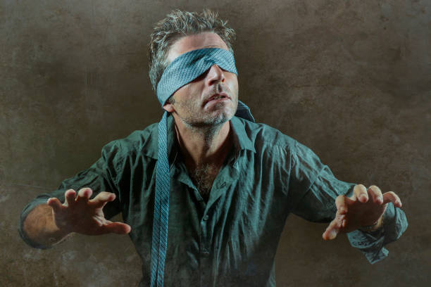 istock young lost and confused man blindfolded with necktie playing internet trend dangerous viral challenge with eyes blind acting doubtful guided by intuition isolated on dark background 1092242938