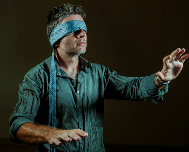 istock young lost and confused man blindfolded with necktie playing internet trend dangerous viral challenge with eyes blind acting doubtful guided by intuition isolated on dark background 1092243032