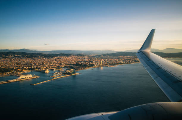 Airplane wing on the sky above Barcelona.