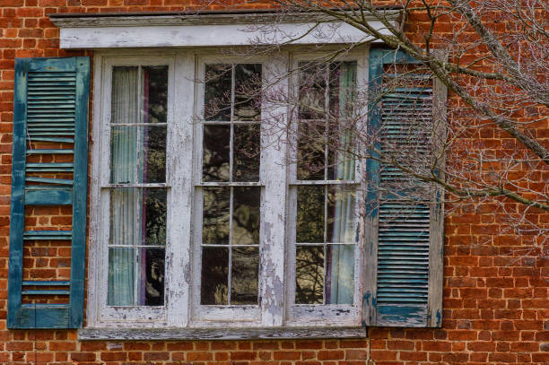istock Close up of a window and shutters on a brick wall 1092251152