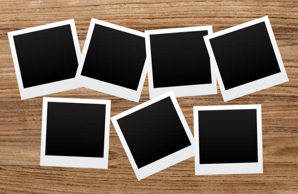 istock Polaroids on wooden background 1092254648