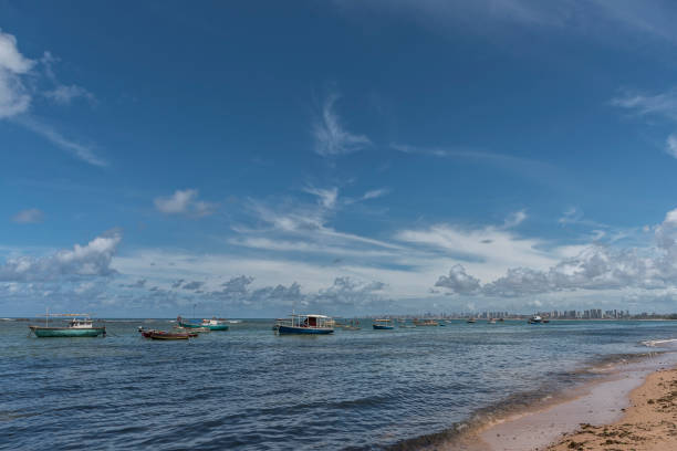 istock Beach with boats moored, on sunny day with clouds in the sky. 1092257596