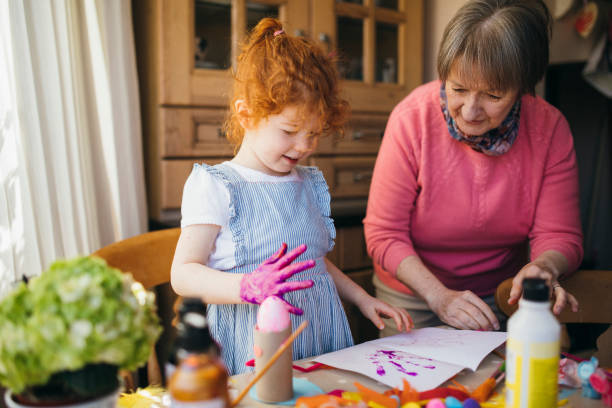 istock Painting with Grandma 1092259956