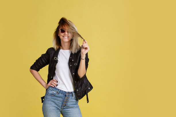 istock rock girl posing in the studio in sunglasses 1092260032