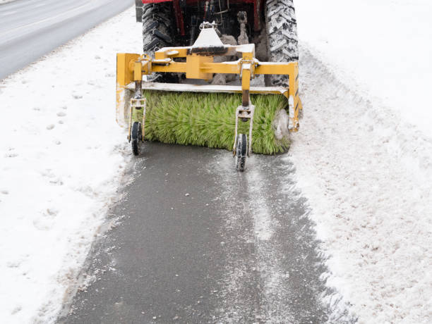 istock cleaning sidewalk pavement with snowplow 1092260090