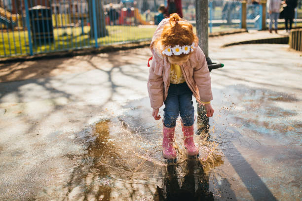 istock Splashing in a Puddle of Water 1092264698