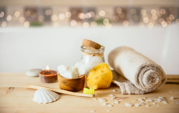 istock Using natural material products in home, different eco friendly cosmetic products in bathroom. Minimizing ecological footprint concept. Bamboo bath towel, biodegradable bamboo toothbrush, coconut oil. 1092267190