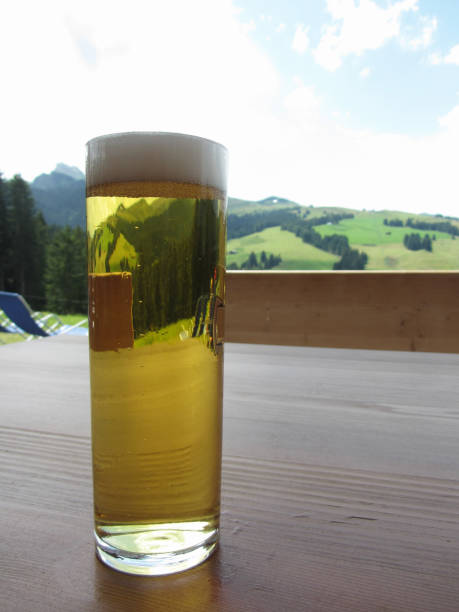 istock Glass of beer on the table on mountain blurred background 1092267498