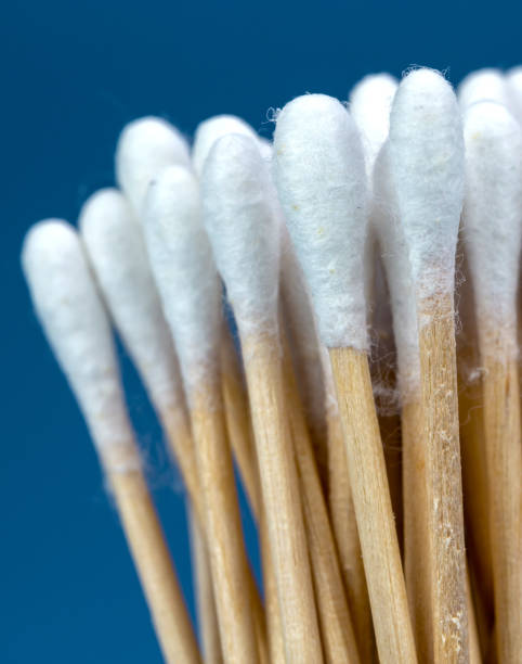 istock wood cotton buds isolated on blue background 1092268022