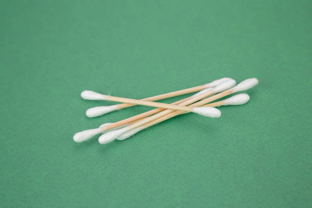 istock wood cotton buds isolated on green background 1092269212