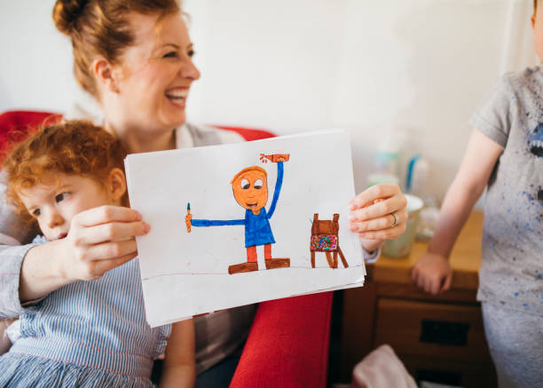 istock Showing Mummy His Drawings 1092269256