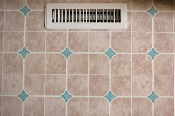 Household object - white colored air vent on linoleum floor