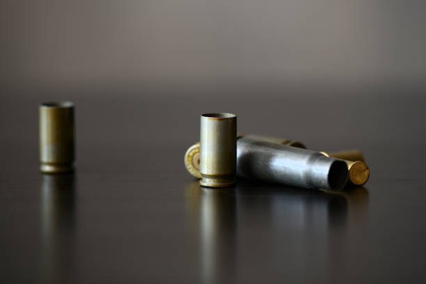 istock Empty old bullet cartridges on a dark background close up 1092270956