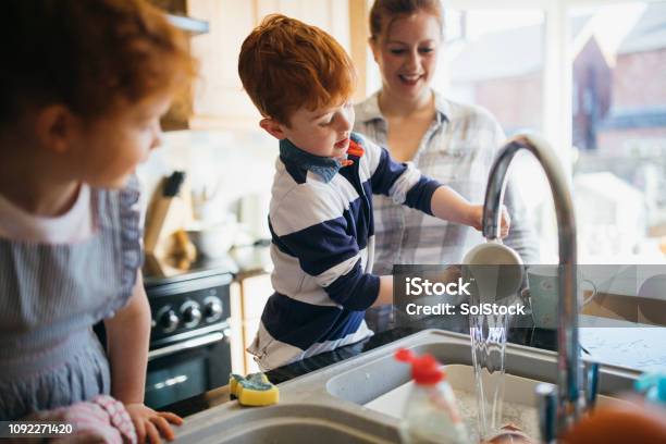 Having Fun Washing The Dishes Stock Photo - Download Image Now - Family, Domestic Life, Child
