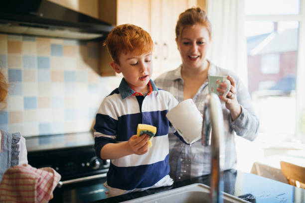 istock Helping Mum Wash the Dishes 1092271440
