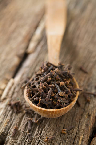 istock cloves in a wooden spoon 1092274254