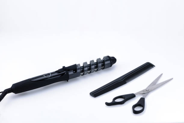 istock Grey hair iron with accessory on the white background with copy space. 1092274612