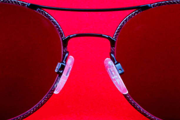 istock Sunglasses Lenses Isolated on a Red Background 1092275752