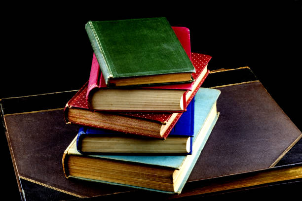 istock Pile of Old Books on a Black Background 1092275798