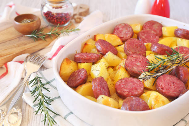 istock Fried potatoes with sausages and rosemary 1092276216