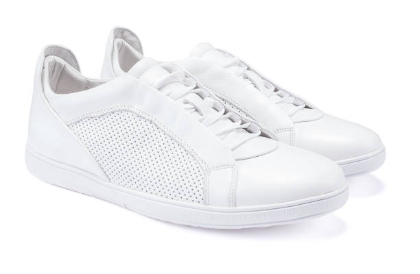 Pair of new white sneakers on white background Pair of new white leather sneakers on white background womens blue suede shoes stock pictures, royalty-free photos & images