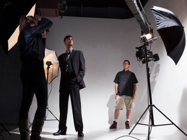 istock People Working Behind the Scenes while Filming on a Film Set 1092281080