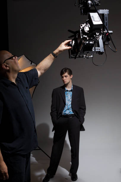 istock People Working Behind the Scenes while Filming on a Film Set 1092281370