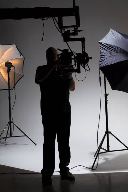 istock Cameraman Behind the Scenes on a Film Set 1092281458
