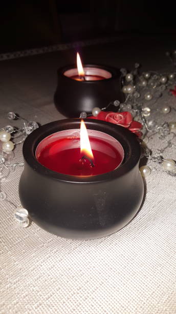istock Red candle in black candle holder 1092285454