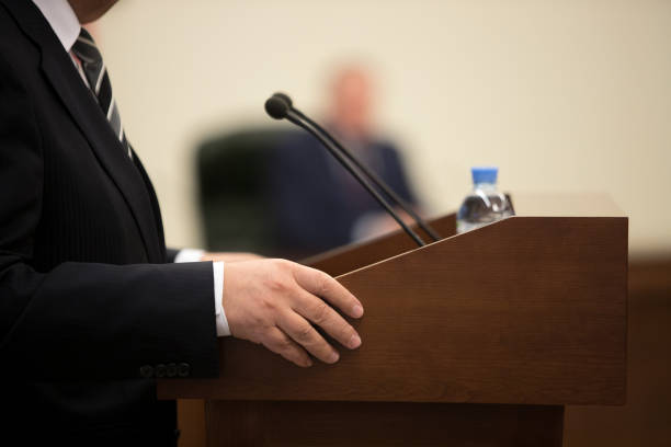 istock before a conference, the microphones in front of empty chairs. 1092287096