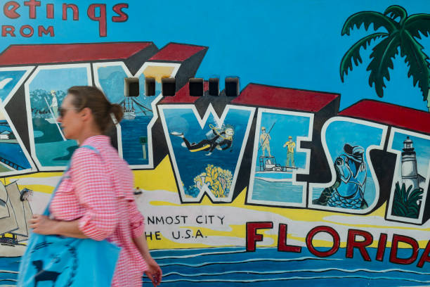 Key West, Florida, United States - August 15, 2018: Image of a woman walking on the streets downtown in Key West, Florida Keys - United States